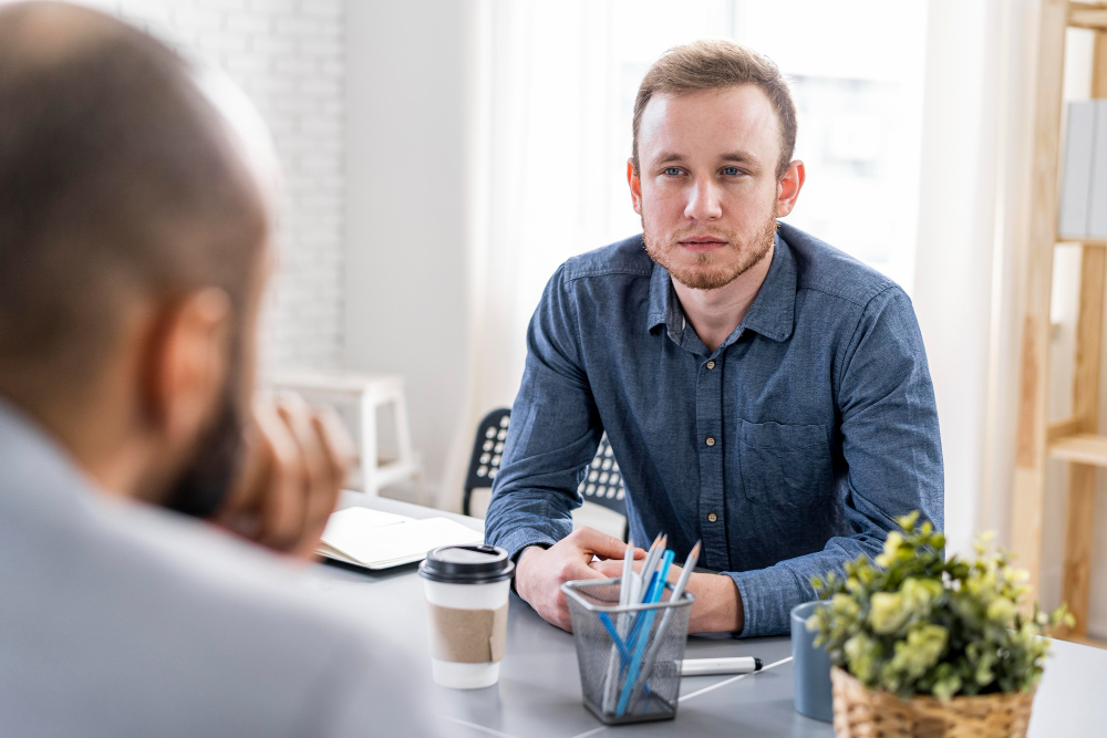 coach in gesprek met cliënt
